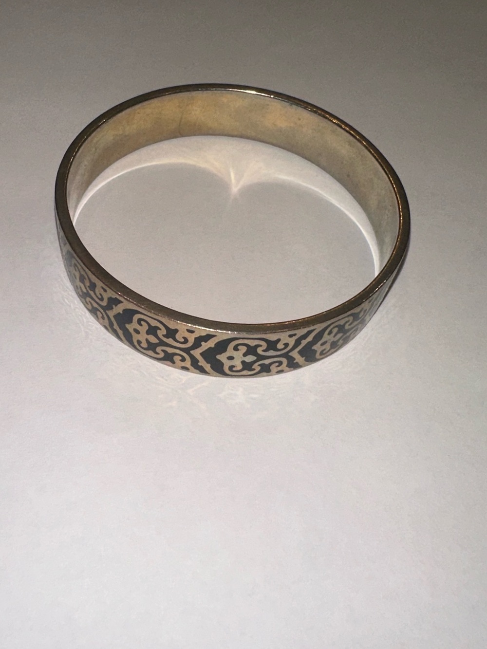 C. Wonder Black Enamel Scroll Filigree Bangle Bracelet Gold Tone Logo Stamped